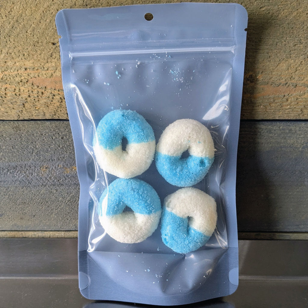 Four freeze dried blue raspberry gummy rings