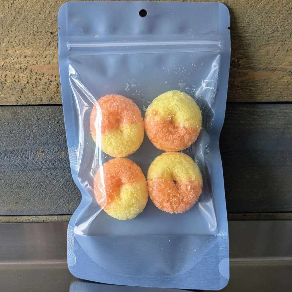 Four freeze dried peach gummy rings